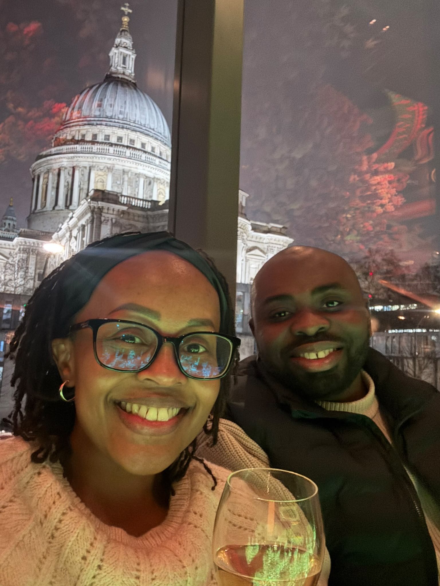 Leo and Njoki at dinner with a view of St Paul’s